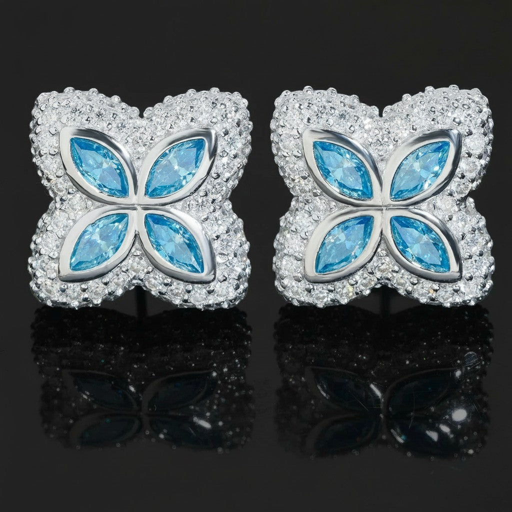 Petey's jewelry 925 sterling silver clover stud earrings featuring marquise-cut blue moissanite and white stones.
