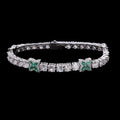 Petey's jewelry silver-plated tennis chain featuring round clear zircons and green four-leaf clover accents