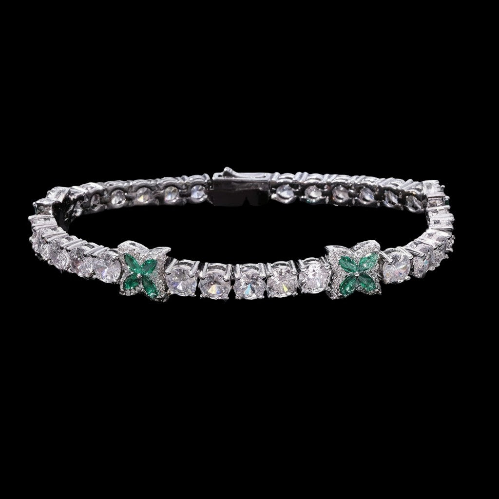 Petey's jewelry silver-plated tennis chain featuring round clear zircons and green four-leaf clover accents