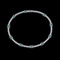 Petey's jewelry silver-plated tennis chain featuring round white zircon stones and green four-leaf clover accents.