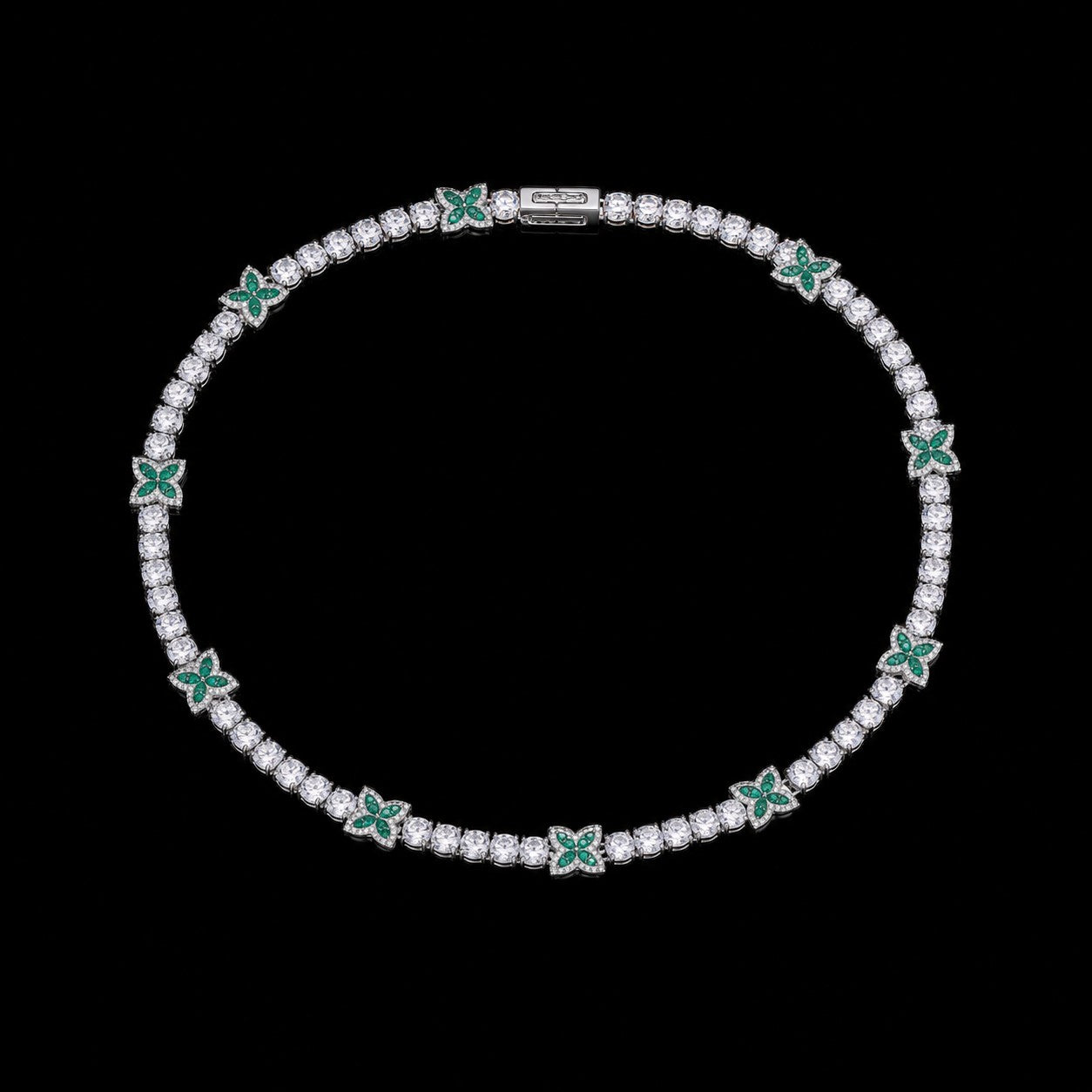 Petey's jewelry silver-plated tennis chain featuring round white zircon stones and green four-leaf clover accents.