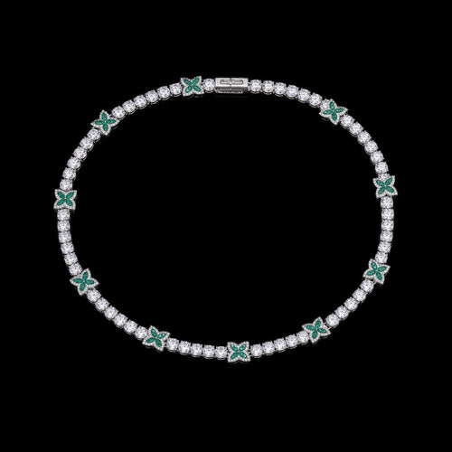 Petey's jewelry silver-plated tennis chain featuring round white zircon stones and green four-leaf clover accents.