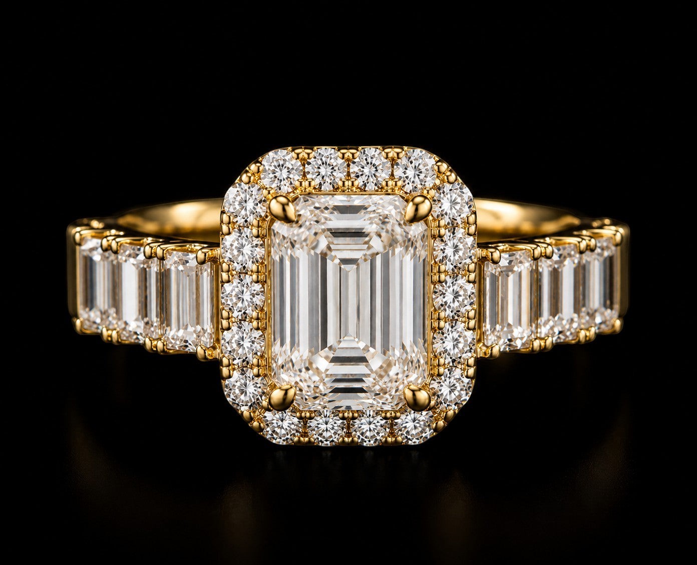 Petey's jewelry emerald cut moissanite engagement ring with halo and baguette side stones, set in yellow gold.