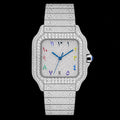 Petey's jewelry men's iced out automatic watch with silver stainless steel band and square dial featuring colorful Arabic numerals and VVS1 moissanite.
