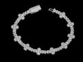 Petey's jewelry iced out 10mm cross link bracelet in rhodium-plated 925 sterling silver with VVS moissanite stones.