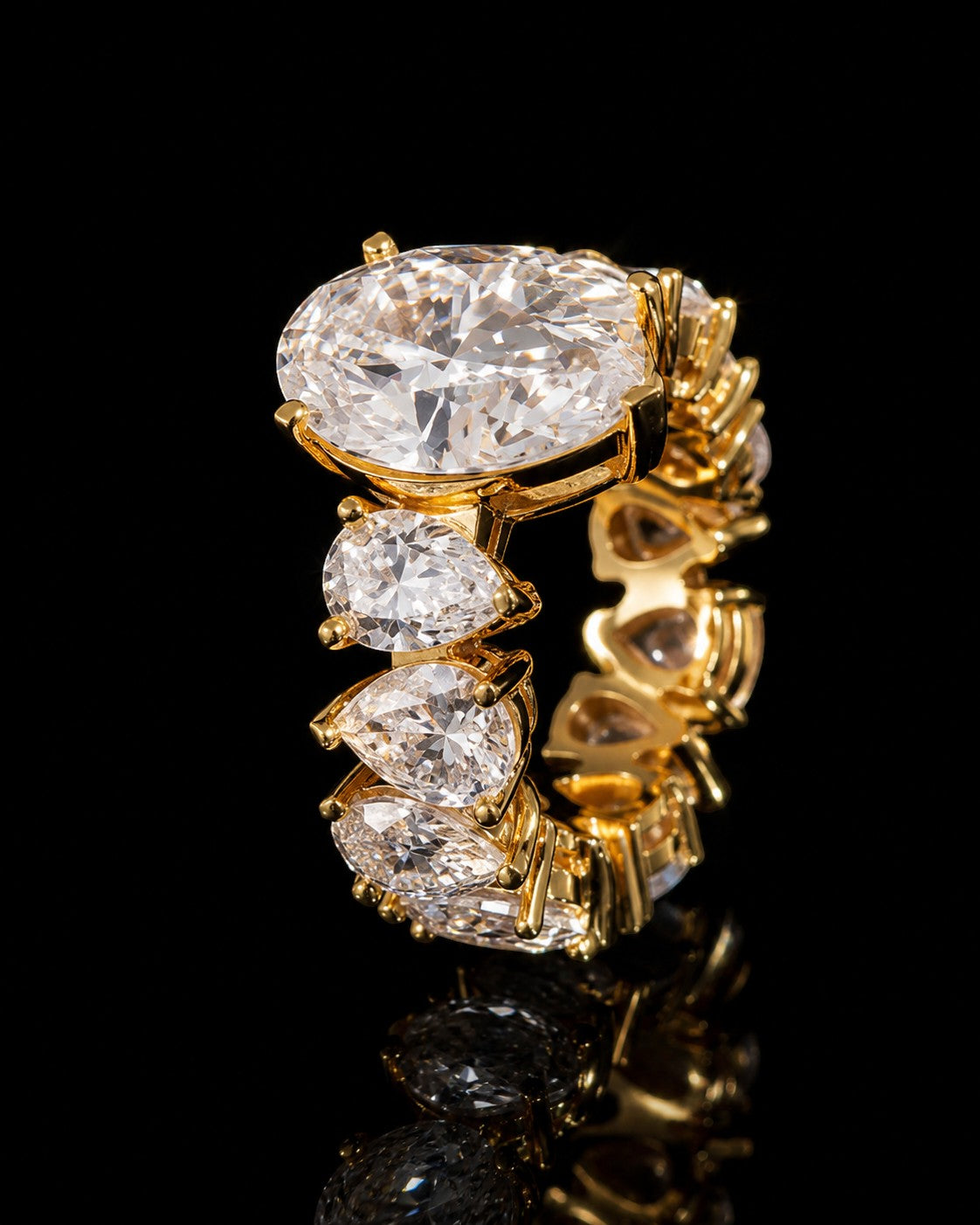 Petey's jewelry gold-plated 925 sterling silver ring with oval and pear-cut VVS moissanite stones, full diamond iced out design.