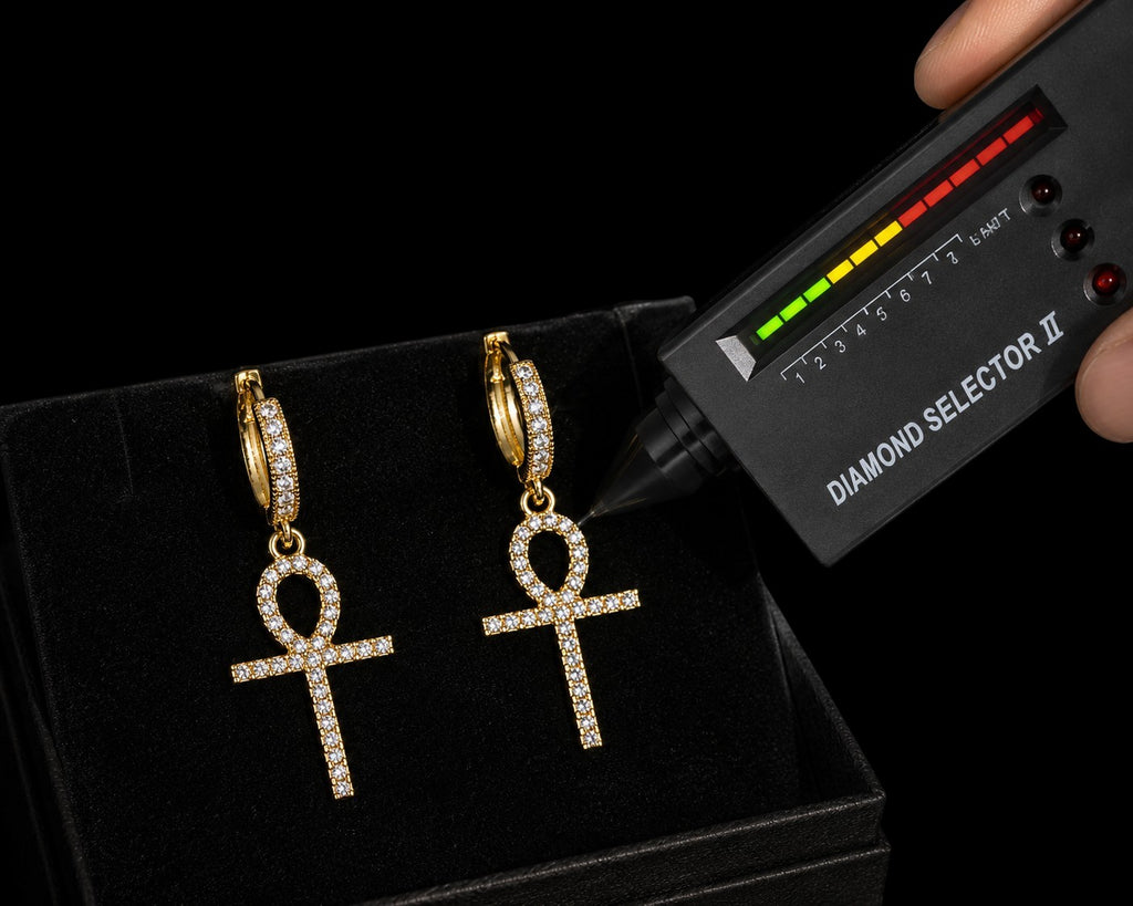 Petey's jewelry gold-plated sterling silver hoop earrings with iced-out VVS moissanite ankh cross charms.