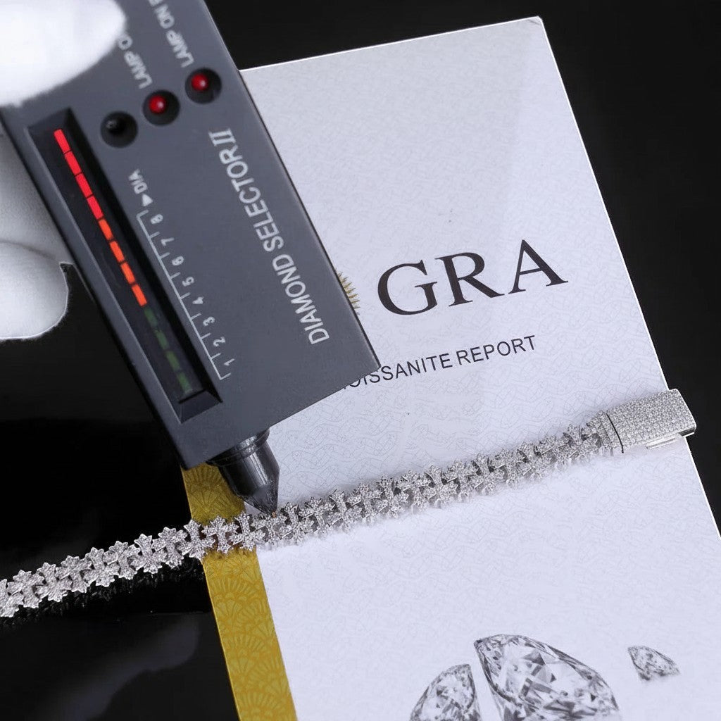 Petey's jewelry 8mm silver cross Cuban chain bracelet with VVS moissanite stones being tested by a diamond selector.