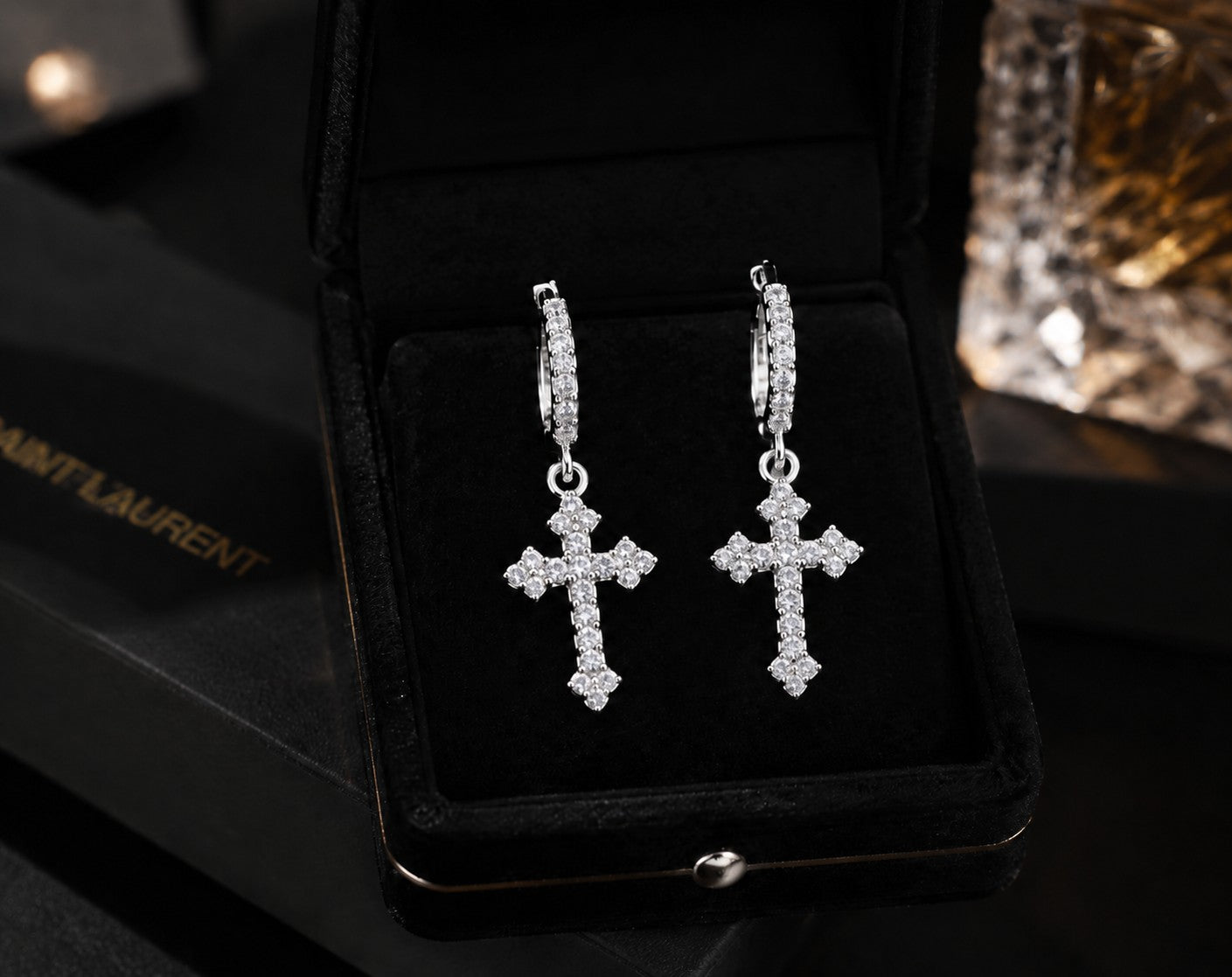 Petey's jewelry iced out VVS moissanite cross hoop earrings in 925 sterling silver, presented in a black gift box.