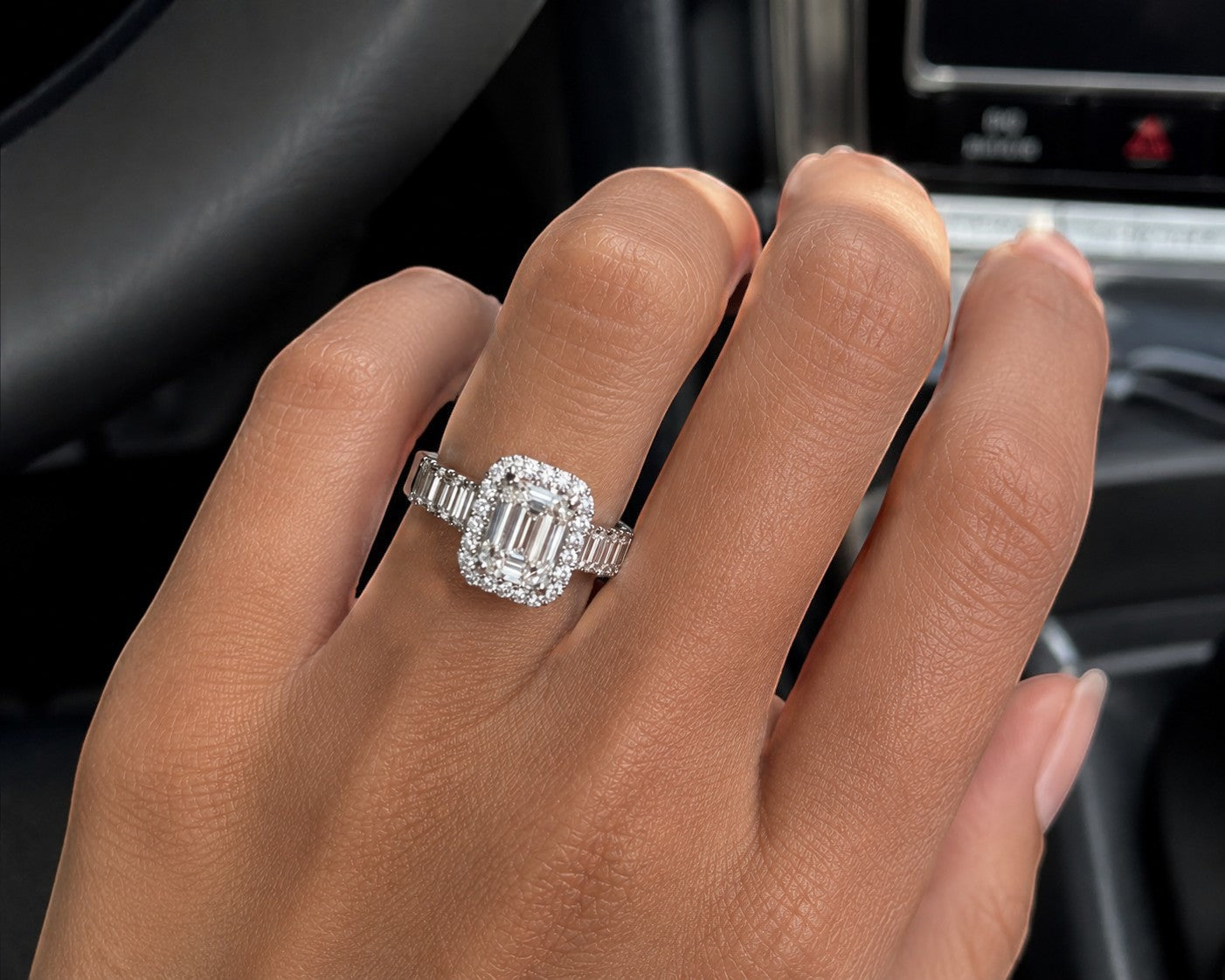 Petey's jewelry women's 925 sterling silver ring with emerald-cut moissanite center stone and baguette & round diamond halo.