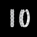 Petey's jewelry sterling silver huggie hoop earrings featuring round brilliant cut VVS moissanite stones in claw setting