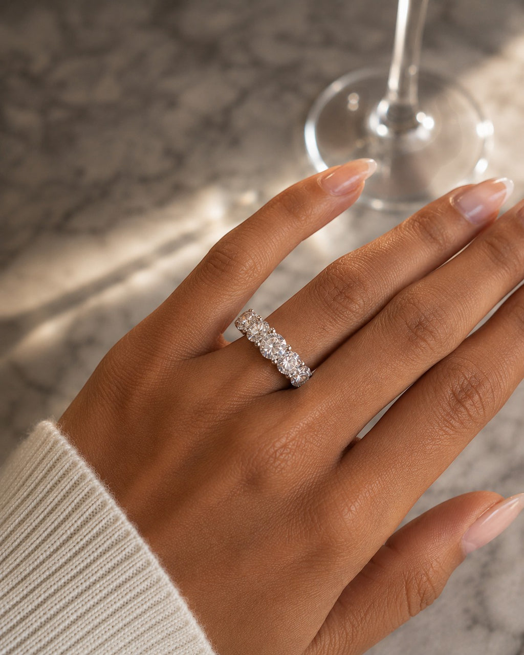 Petey's jewelry women's sterling silver ring with five round brilliant cut VVS moissanite stones in a prong setting.