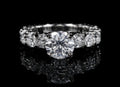 Petey's jewelry women's sterling silver ring with a large round moissanite center stone and smaller stones along the band.