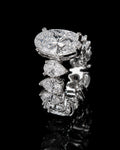 Petey's jewelry luxurious women's 925 silver ring with VVS moissanite stones in oval and pear cuts, prong-set on a black background.