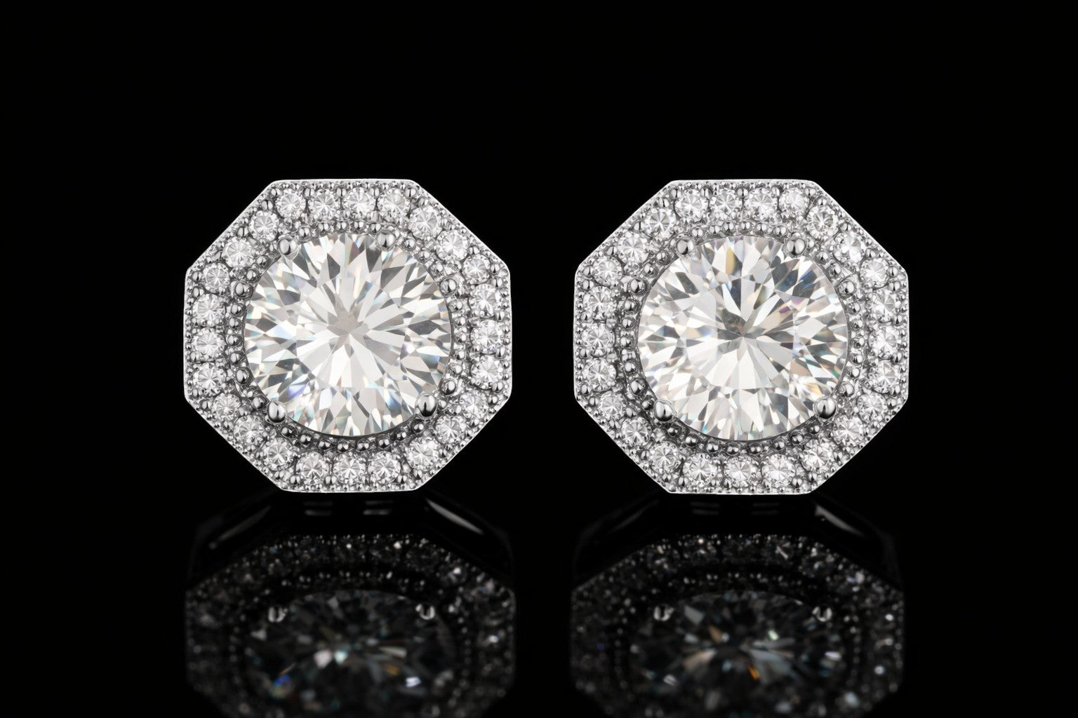 Petey's jewelry round brilliant cut moissanite stud earrings in sterling silver with a halo bezel setting.