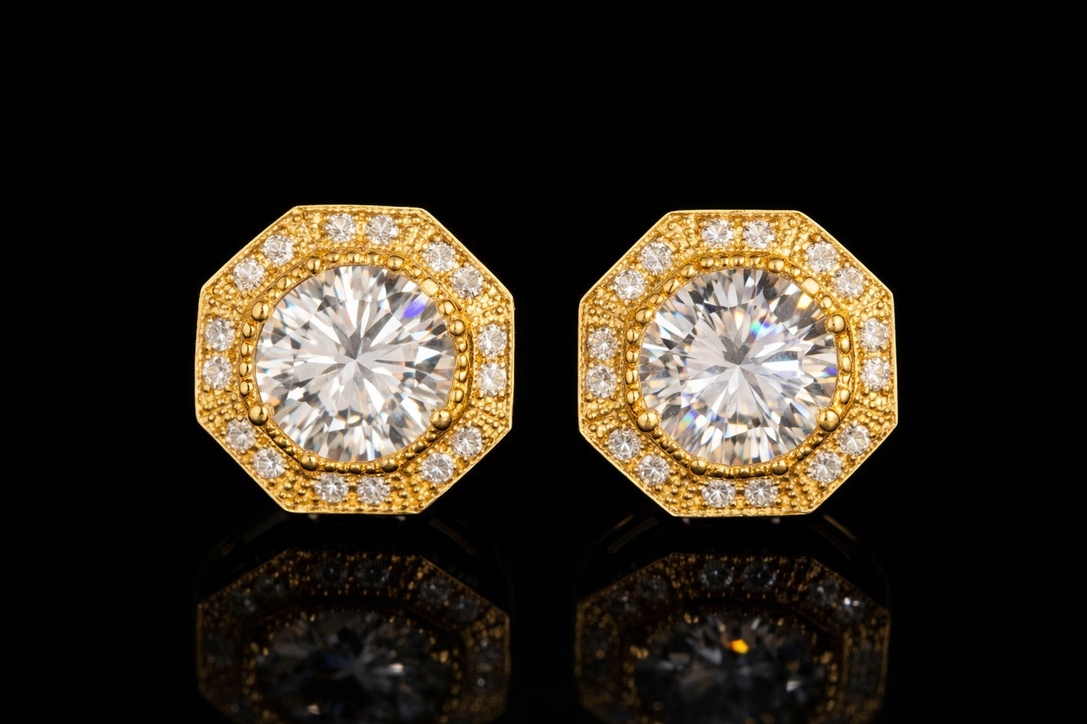 Petey's jewelry gold-plated sterling silver stud earrings featuring round brilliant cut moissanite in a bezel setting.