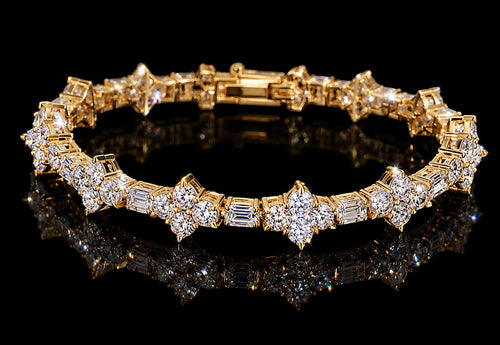 Petey's jewelry gold-plated sterling silver tennis chain featuring sparkling round and baguette-cut VVS1 moissanite stones.