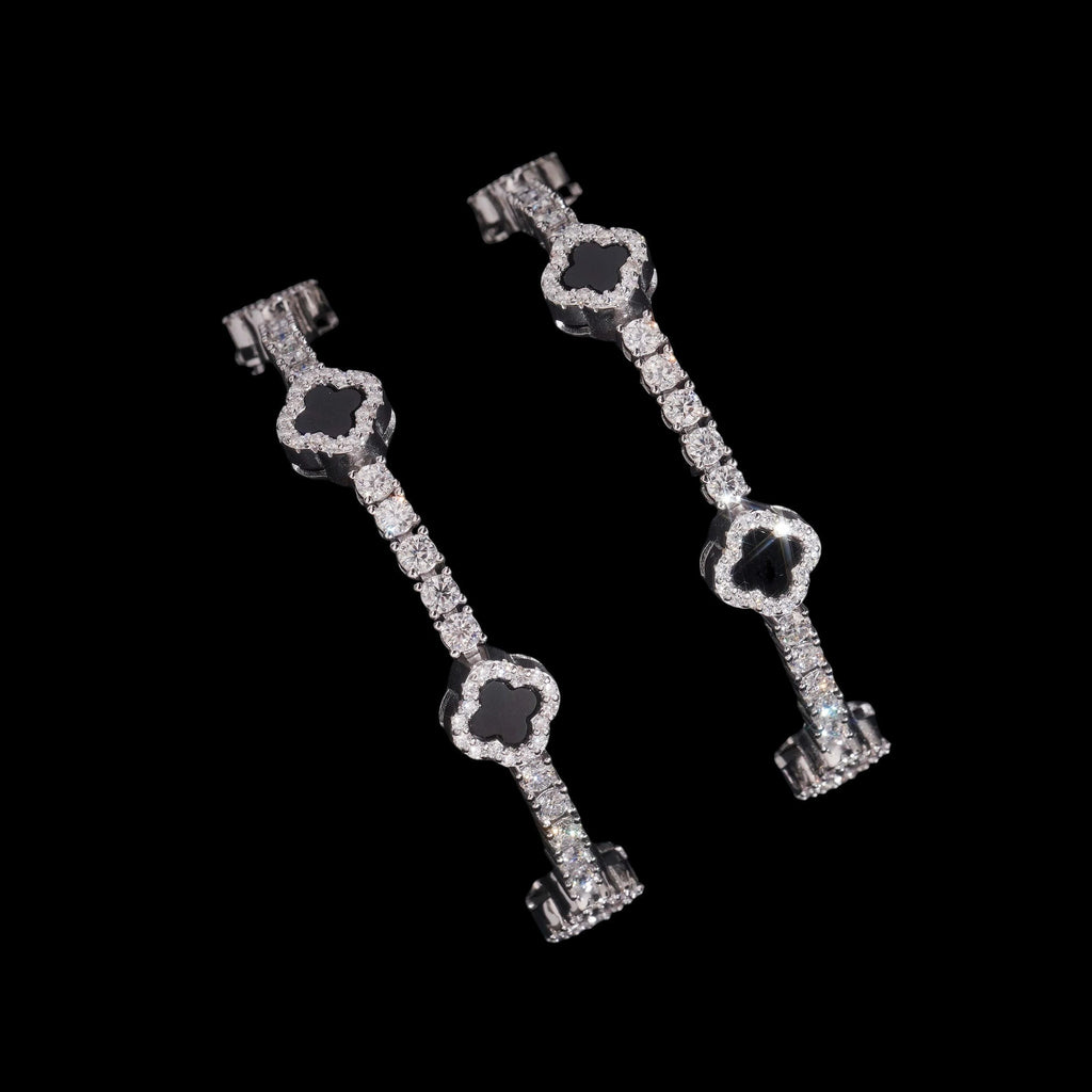 Petey's jewelry 925 sterling silver clover tennis bracelet with iced out moissanite diamonds and black stone accents.