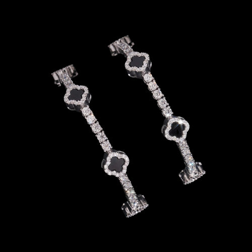 Petey's jewelry 925 sterling silver clover tennis bracelet with iced out moissanite diamonds and black stone accents.