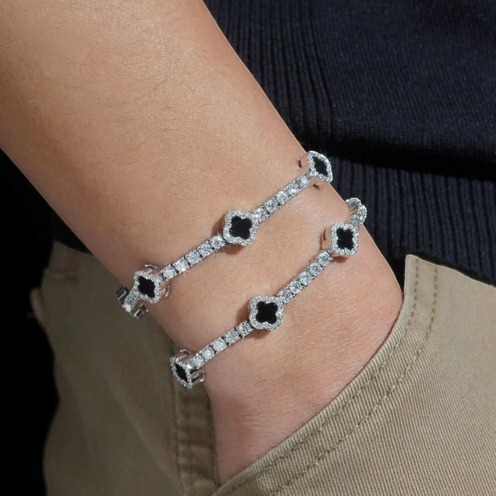 Petey's jewelry 925 sterling silver clover tennis bracelet with iced out moissanite diamonds on a wrist