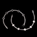 Petey's jewelry 925 sterling silver clover tennis bracelet with iced out moissanite diamonds and rhodium plating.