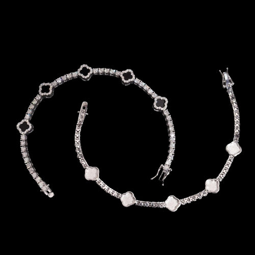 Petey's jewelry 925 sterling silver clover tennis bracelet with iced out moissanite diamonds and rhodium plating.