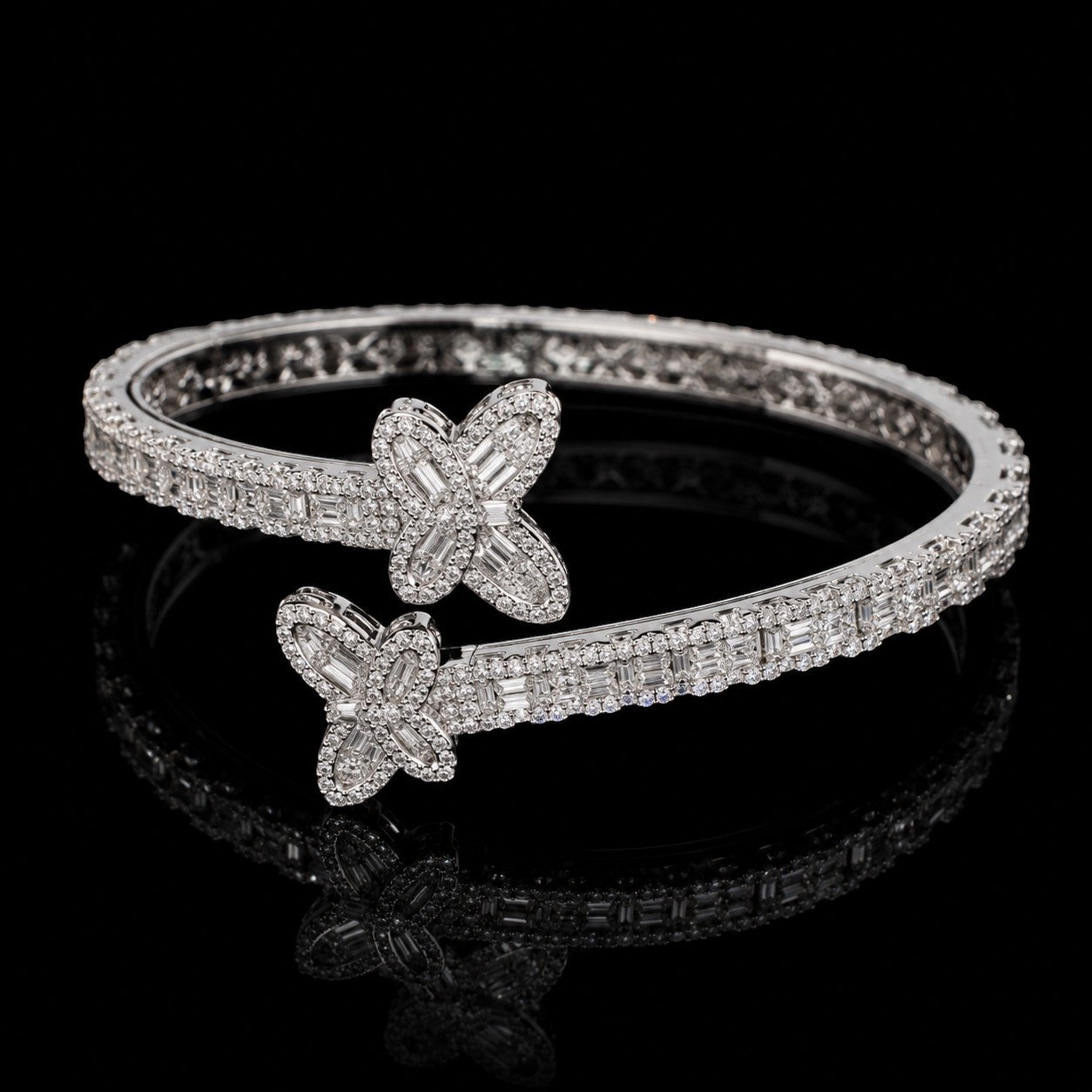 Petey's jewelry 925 sterling silver hip hop bangle featuring emerald cut VVS moissanite stones in a butterfly design.