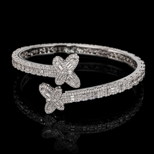 Petey's jewelry 925 sterling silver hip hop bangle featuring emerald cut VVS moissanite stones in a butterfly design.
