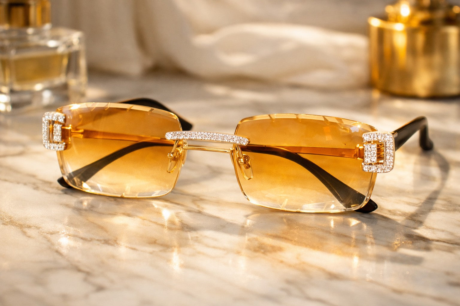 Petey's jewelry brown iced out designer glasses with diamond-cut accents on a marble surface.