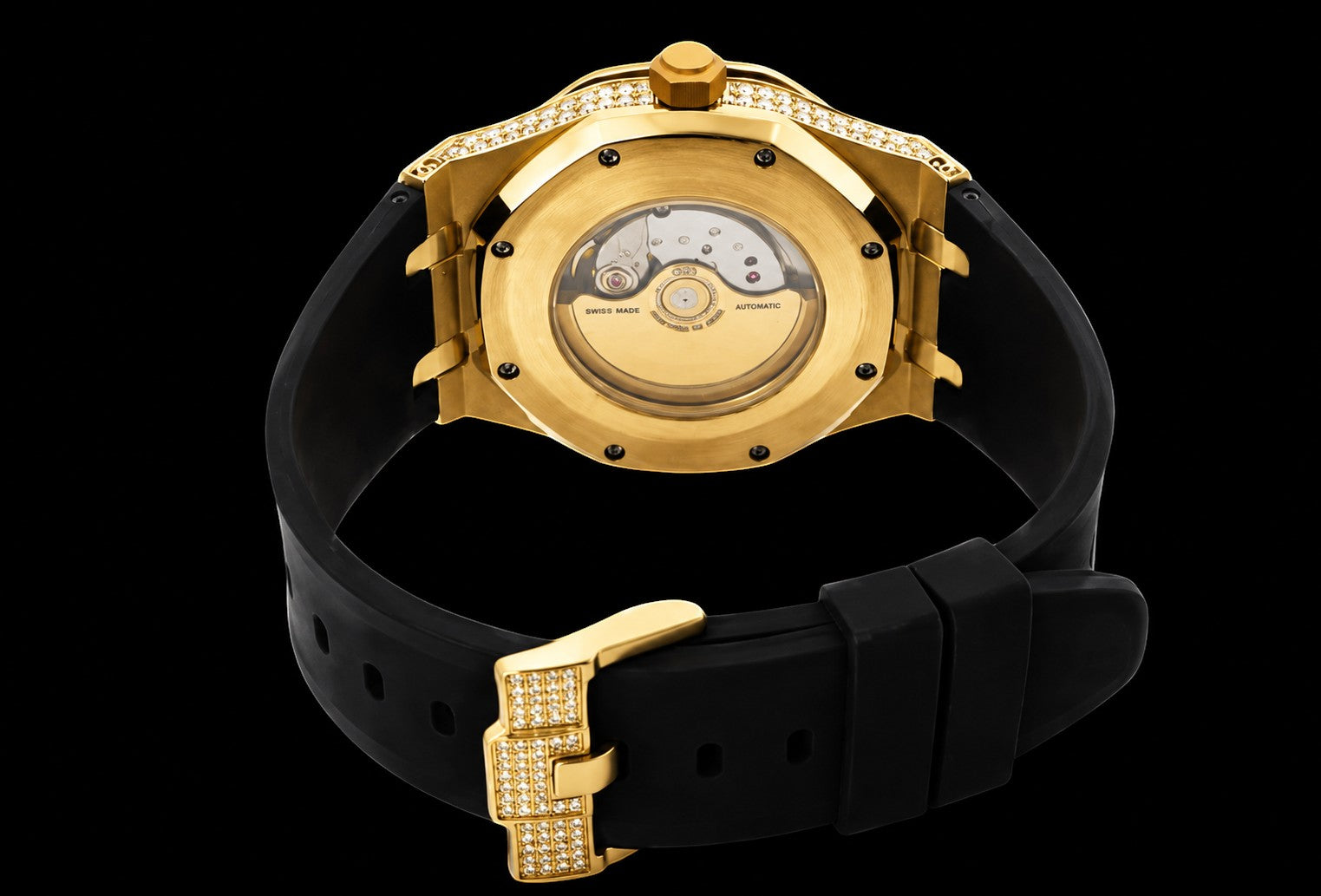 Petey's jewelry gold moissanite watch with black silicone band and diamond-encrusted buckle. Features automatic movement visible through case back.