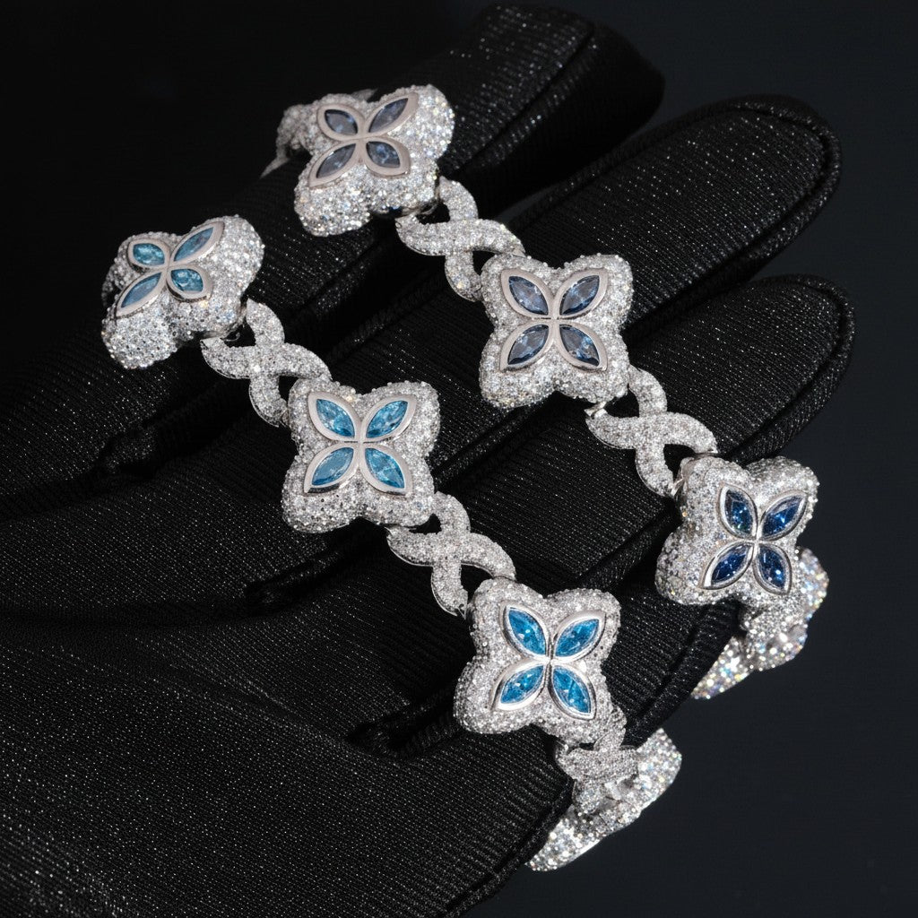 Petey's jewelry 925 sterling silver iced out bracelet featuring blue moissanite clover links and white stones