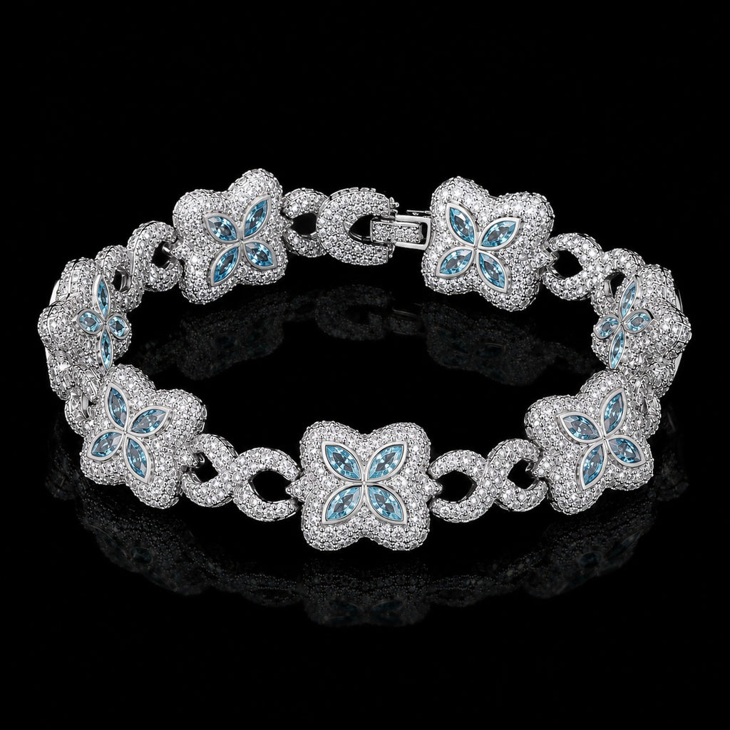 Petey's jewelry iced out clover bracelet in 925 sterling silver with VVS blue moissanite stones on a black background