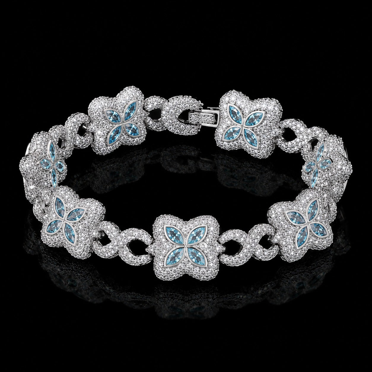 Petey's jewelry iced out clover bracelet in 925 sterling silver with VVS blue moissanite stones on a black background