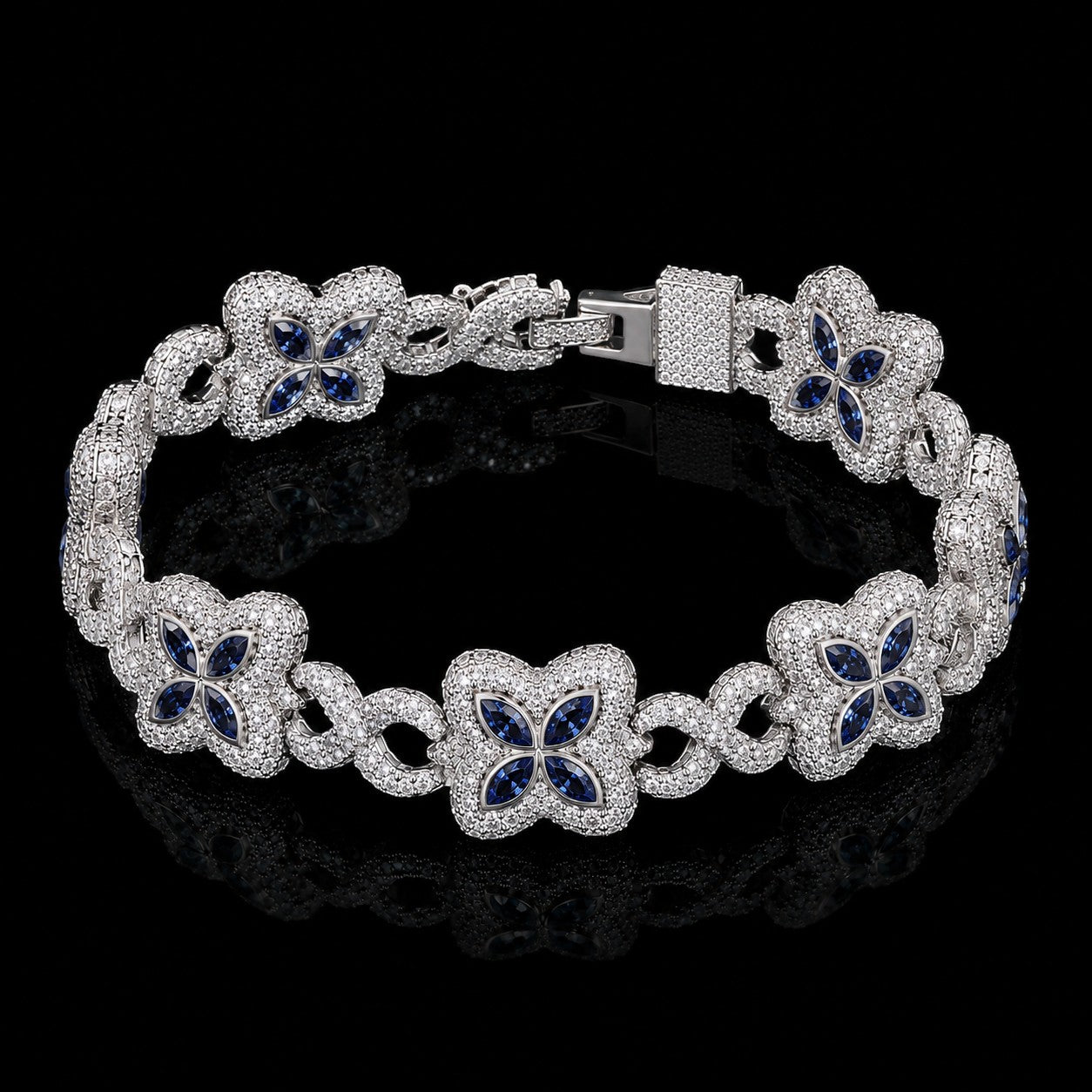 Petey's jewelry iced out clover bracelet in 925 silver with VVS blue moissanite stones and a claw setting.