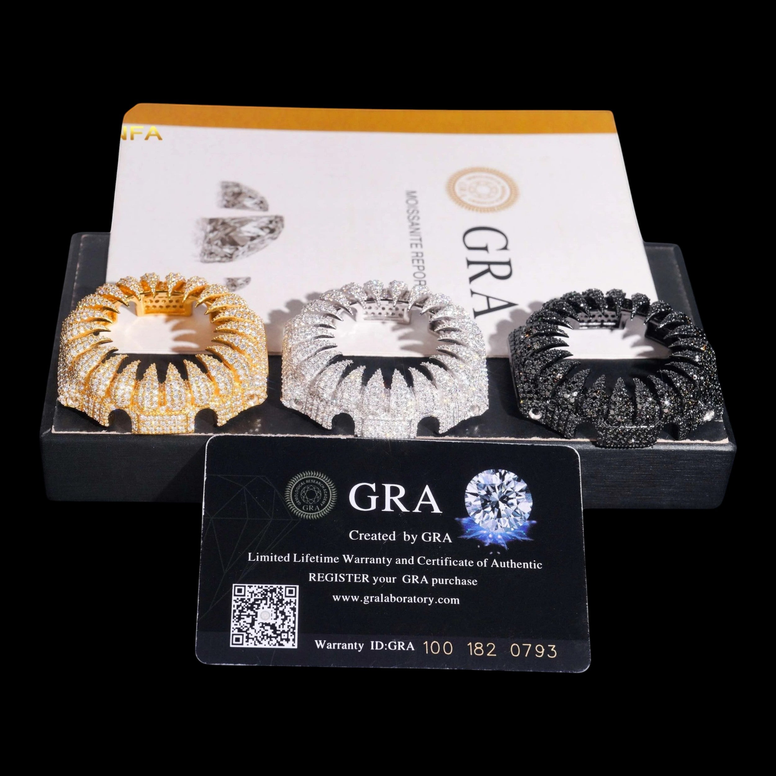 Petey's jewelry: Three iced out watch bezels in gold, silver, and black, encrusted with moissanite stones. Includes GRA certification card.
