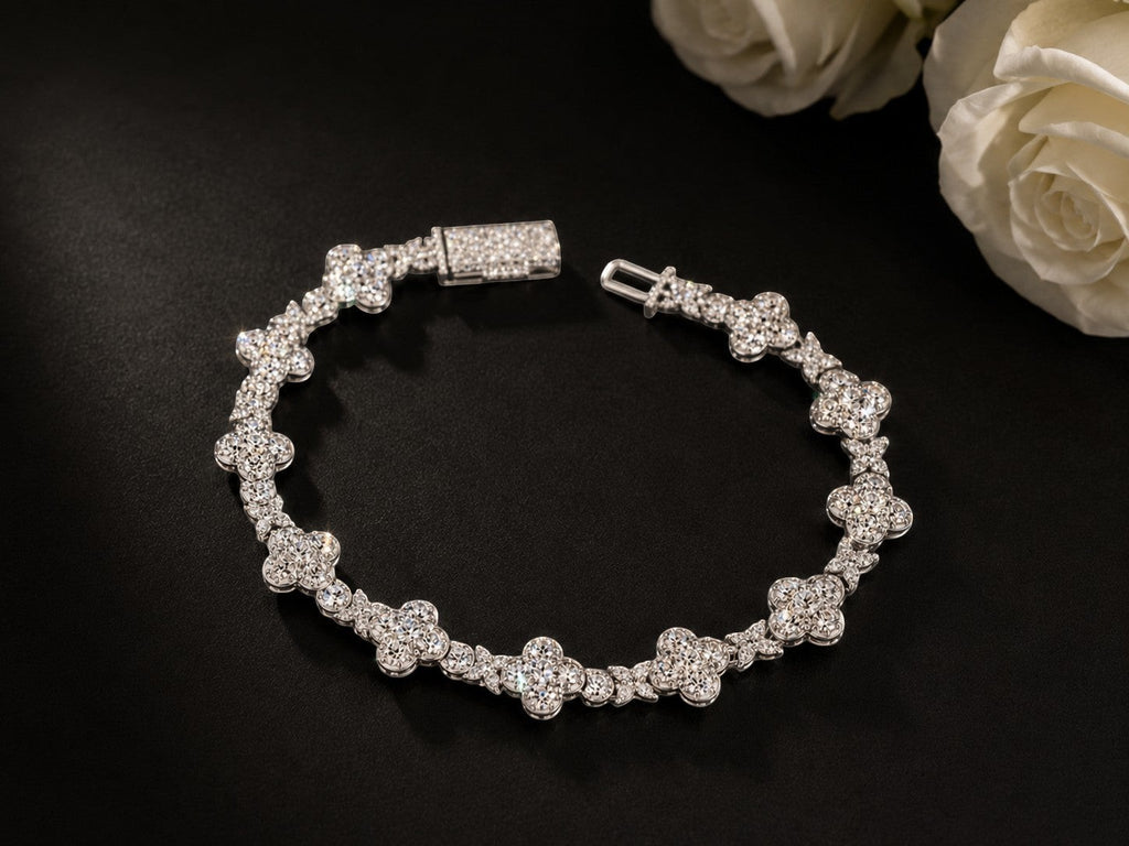 Petey's jewelry iced out moissanite clover link bracelet in rhodium-plated 925 sterling silver on black background.