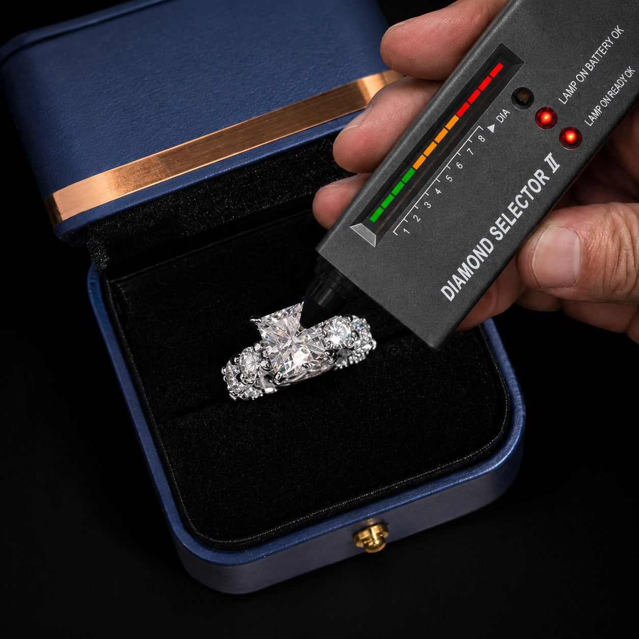 Petey's jewelry radiant cut moissanite engagement ring in sterling silver being tested by a diamond selector.