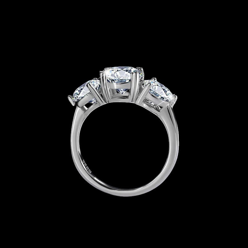 Petey's jewelry Sterling Silver VVS D Color 4CT Moissanite Ring with three round brilliant cut stones, pave setting.