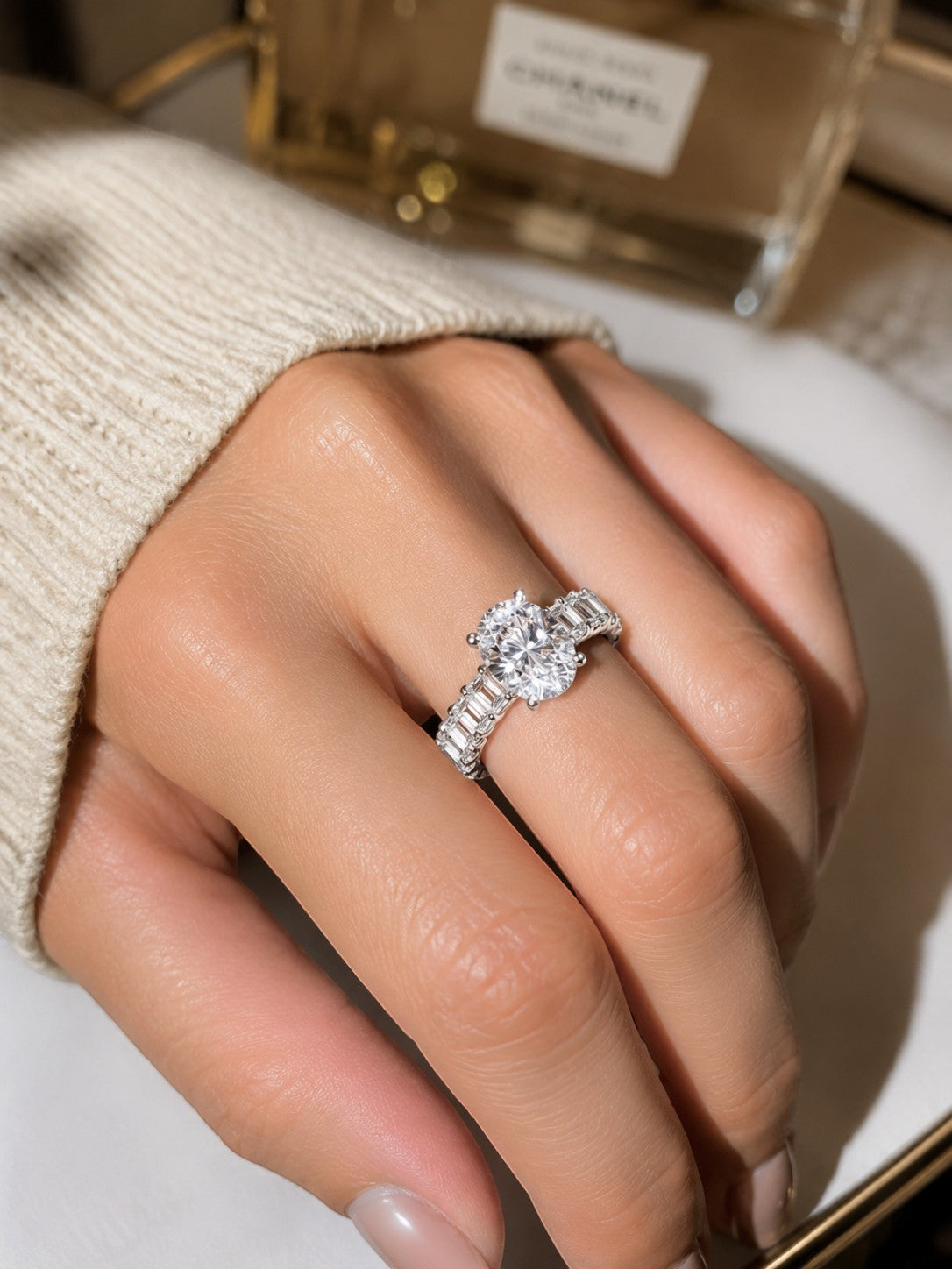 Petey's jewelry women's sterling silver ring with oval moissanite center stone and baguette side stones.