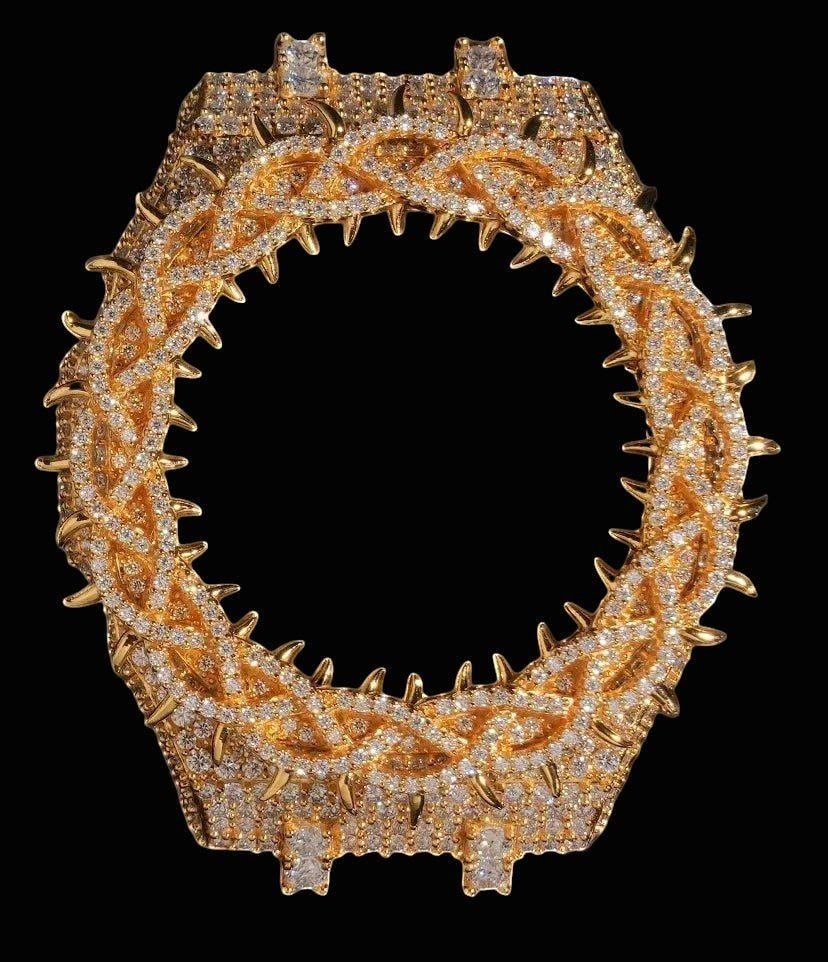 Petey's jewelry gold moissanite watch bezel case with spiked crown design and VVS stones.