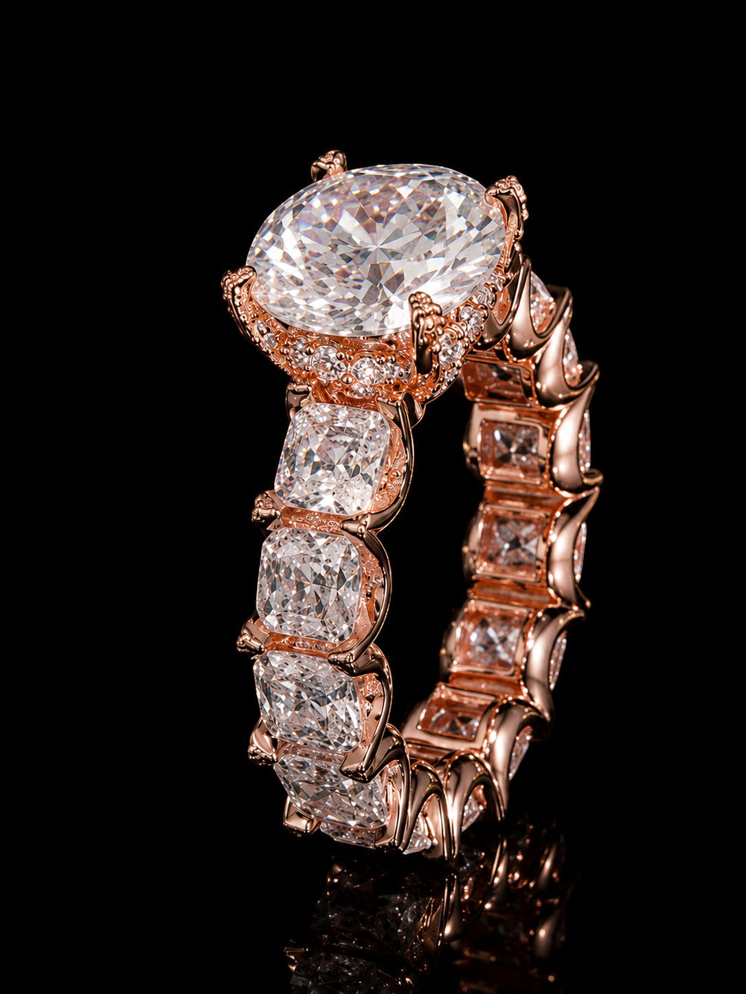 Petey's jewelry rose gold ring with large oval moissanite center stone and cushion-cut moissanite band.