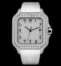 Petey's jewelry Silver Arabic Moissanite Watch with white band, diamond-encrusted bezel, and blue hands. Features Arabic numerals and date window.