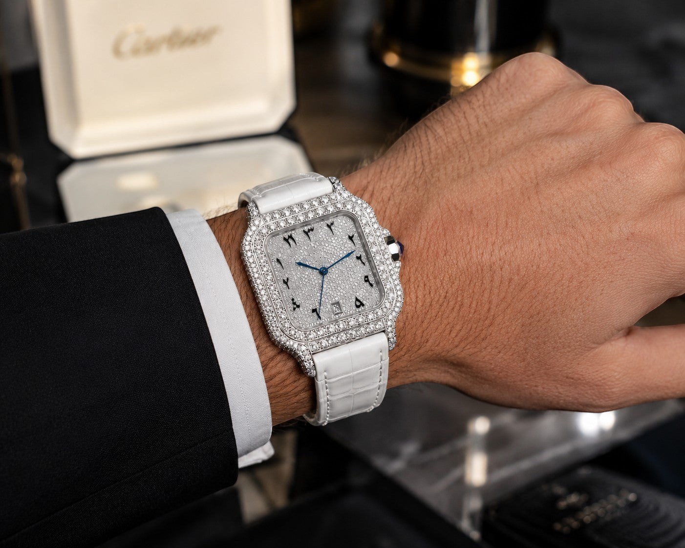 Petey's jewelry silver moissanite watch with white band and colorful Arabic numerals on a man's wrist.